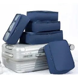 Set da viaggio TRAVEL da 7 pezzi per abbigliamento e cosmetici / Blu