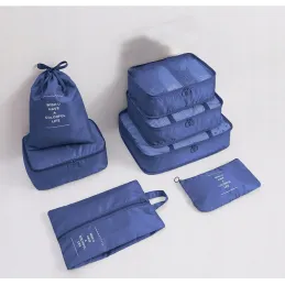 Set da viaggio TRAVEL da 7 pezzi per abbigliamento e cosmetici / Blu
