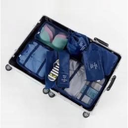 Set da viaggio TRAVEL da 7 pezzi per abbigliamento e cosmetici / Blu