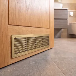 Griglia di ventilazione bifacciale per porta 430 x 115 mm / Patina oro